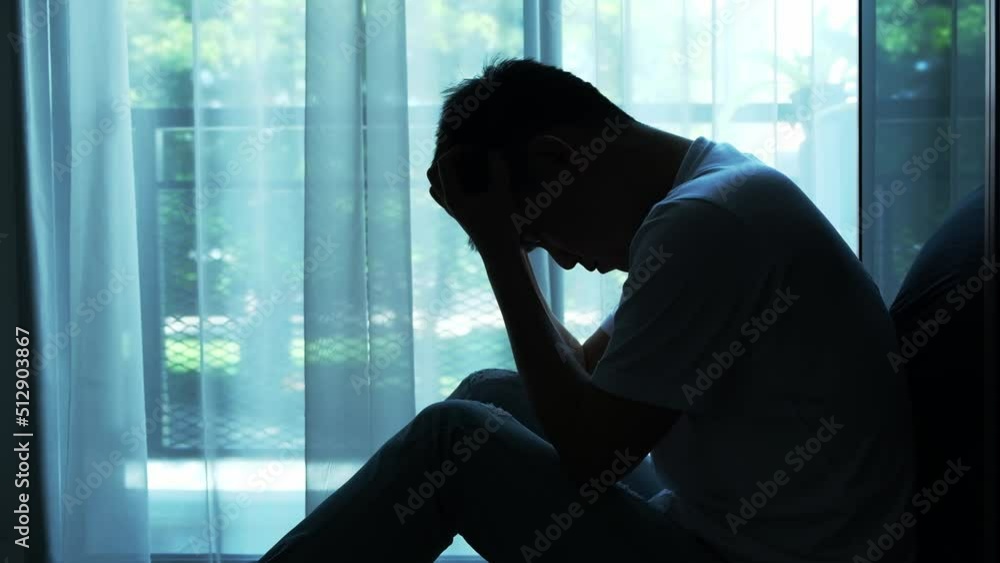 man sitting in the corner of the room have emotional and mental problems He has depression and stress from society and work. medical concept man sitting in the corner of the room have emotional and mental problems He has depression and stress from society and work. medical concept