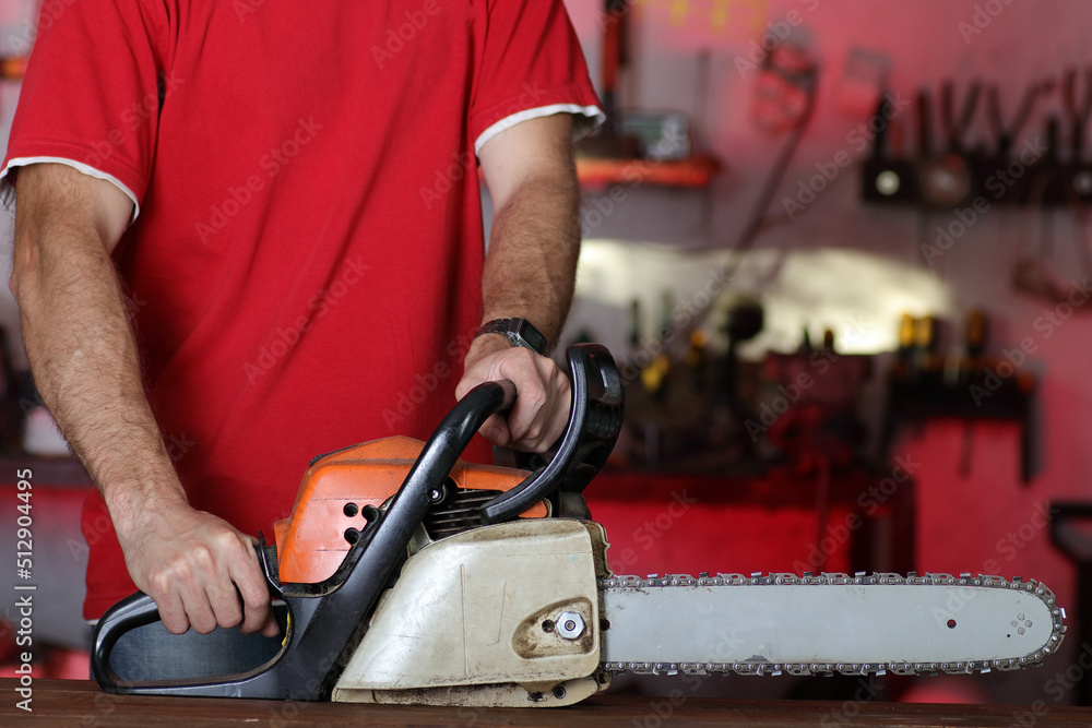 chainsaw with a person in the garage chainsaw with a person in the garage