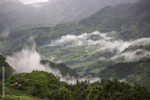 Lao Cai Province,northern Vietnam on July 14,2019:Morning fog,overcast sky and mountain ranges in Sapa.