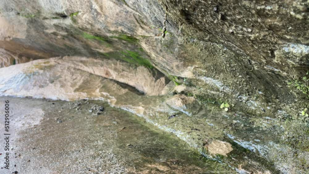 Water Dripping Off Rock Formation Close Up Rocks With Moss and Water Water Dripping Off Rock Formation Close Up Rocks With Moss and Water