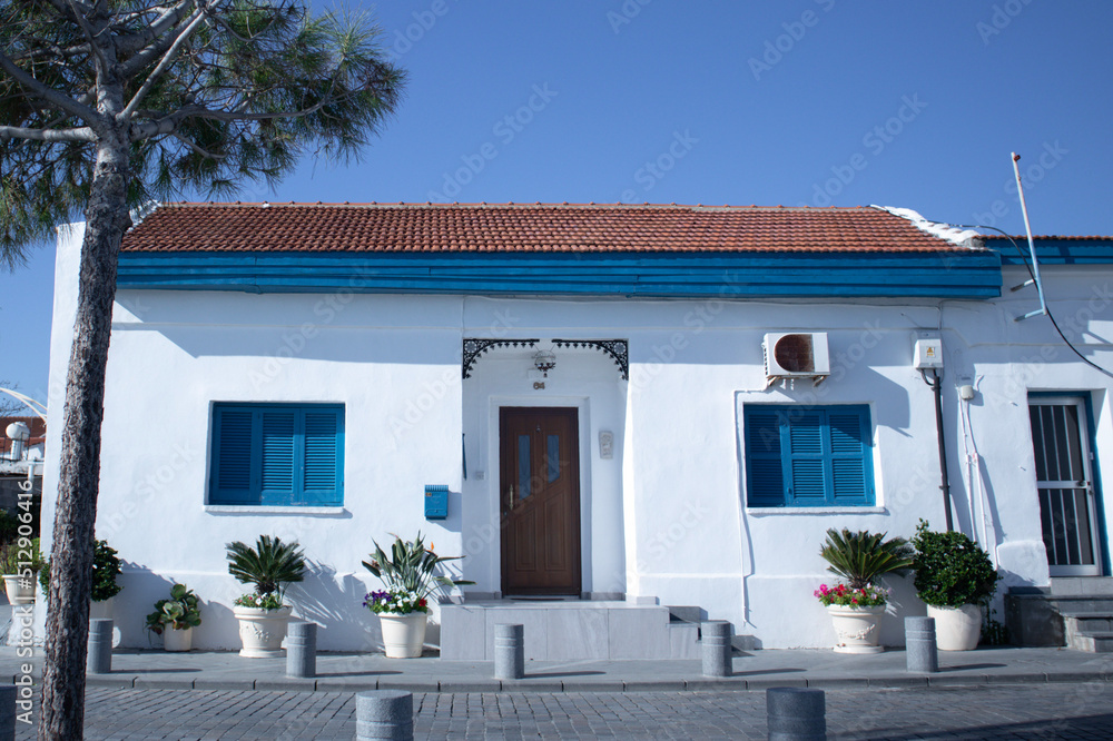 Fototapeta premium Beautiful blue door with windows in old building in Cyprus