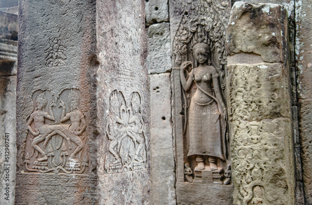 Sculpture of Apsara dancing on a sandstone column in the pagoda of Bayon Angkor Thom Temple, Siem Reap, Cambodia
