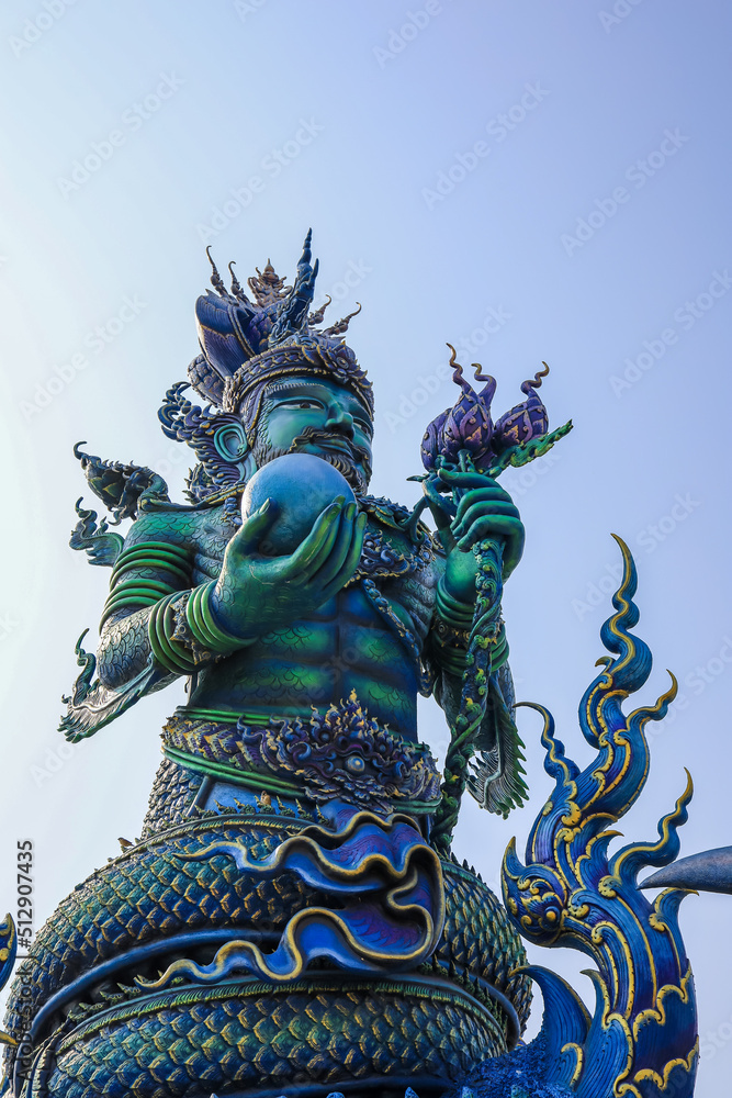 Chiang Rai Province,Northern Thailand on January 19,2020:Angellic Temple Guardians at the entrance pillars of Wat Rong Suea Ten or Blue Temple.