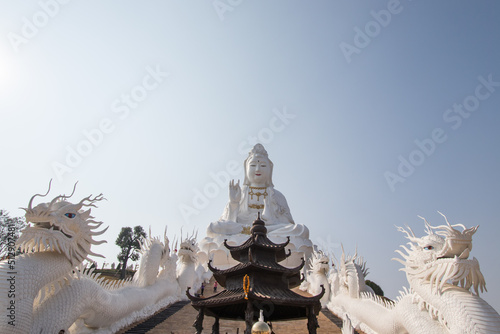 Chiang Rai Province Northern Thailand on January 19 2020 White Guan Yin Statue and beautiful dragon staircases at Wat Huai Pla Kang.