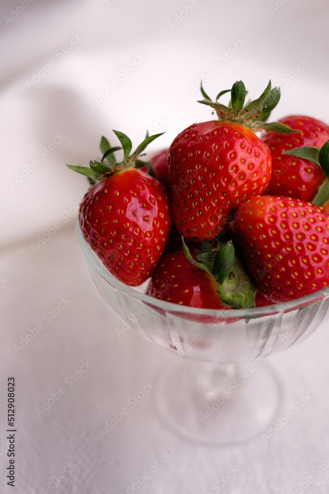 strawberries in a glass bowl strawberries in a glass bowl