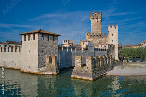 Rocca Scaligera Castle in Sirmione Lake Garda Italy. Aerial view. Popular travel destination on Lake Garda in Italy. Scaligero Castle drone view. Sirmione top view.