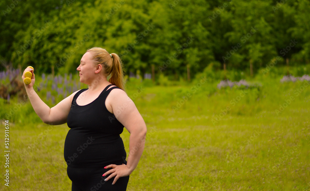 Portrait of cheerful aged woman in fitness wear exercising with yellow dumbbells in park. Portrait of cheerful aged woman in fitness wear exercising with yellow dumbbells in park.