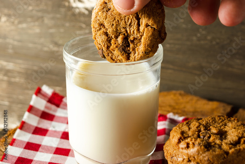 dipping or wetting a cookie, making a splash. morning breakfast concept