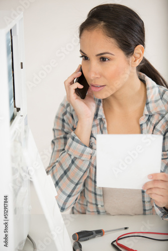 young female technician receiving a call photo