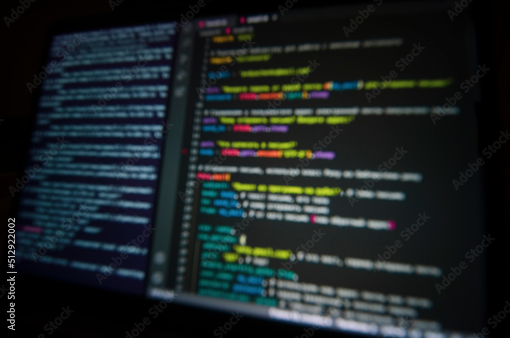background: computer code on laptop screen in blur background: computer code on laptop screen in blur
