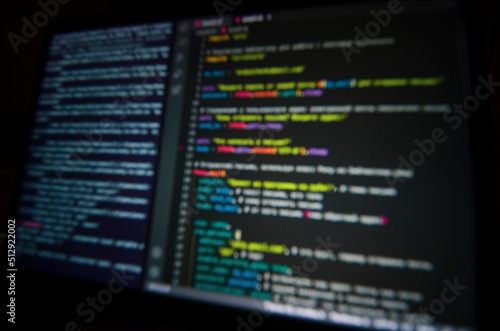 background: computer code on laptop screen in blur
