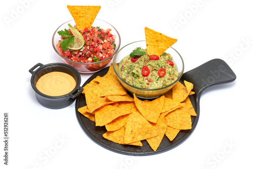 Salsa and guacamole Mexican dip sauce served in glass bowl with nachos or tortilla chips isolated on white background