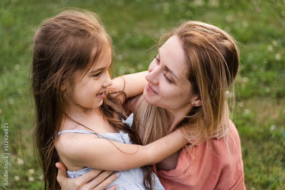 Daughter hug her mom. Hapiness emotion. Family values. Happy family lifestyle. Happiness and joy of mom hugging her child. Daughter hug her mom. Hapiness emotion. Family values. Happy family lifestyle. Happiness and joy of mom hugging her child.