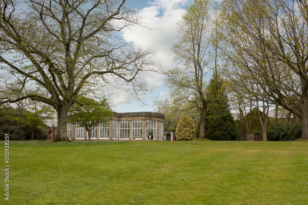 flower hot house surrounded by trees in a local park and gardens flower hot house surrounded by trees in a local park and gardens