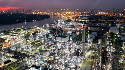 Oil and gas refinery plant form industry zone at night  Aerial view oil and gas Industrial petrochemical fuel power and energy.