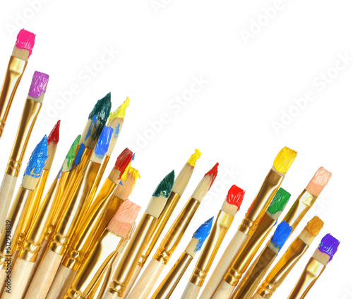 Set of different brushes with paints on white background