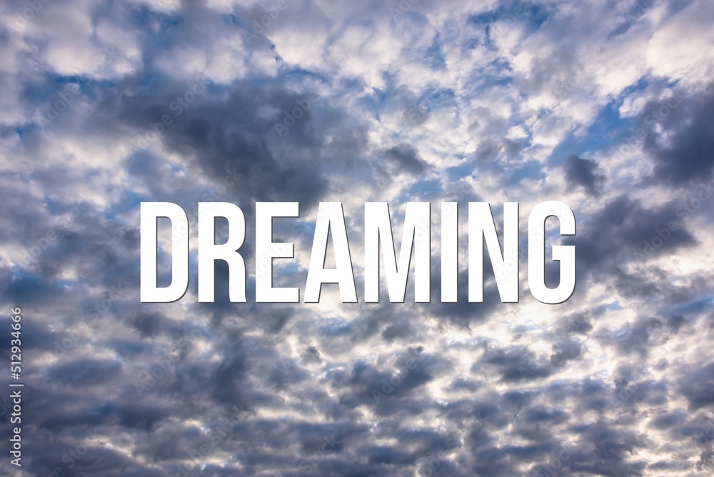 DREAMING - word on the background of the sky with clouds. DREAMING - word on the background of the sky with clouds.