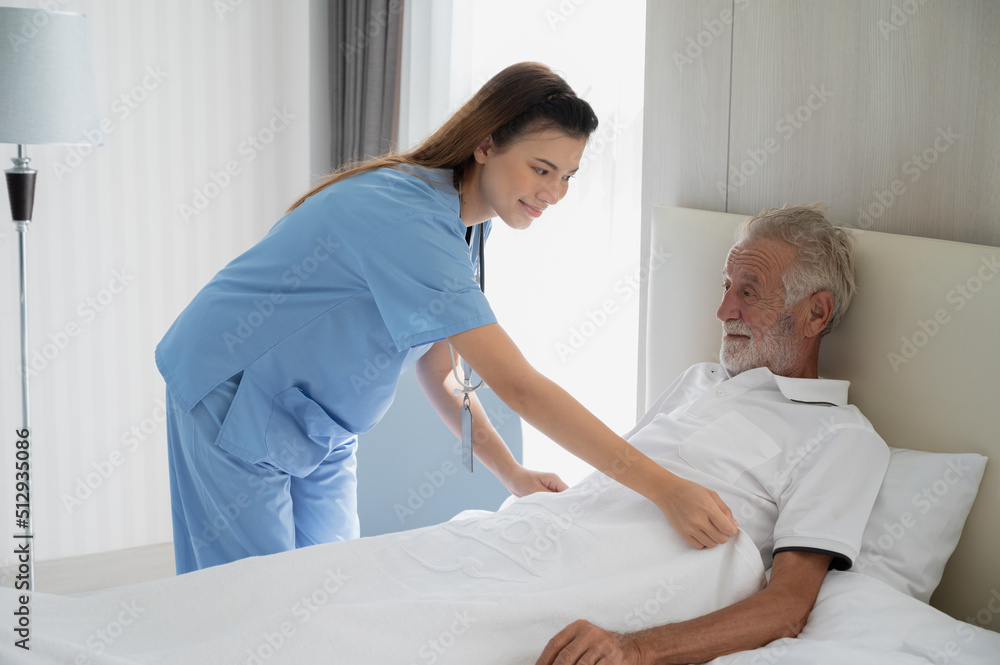 Professional caregiver taking care of elderly woman at home Professional caregiver taking care of elderly woman at home