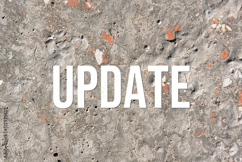 update - word on concrete background. Cement floor, wall.
