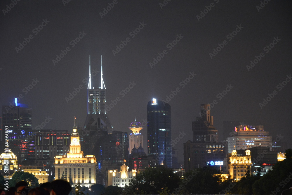 View of night time Shanghai looking from the Pudong side of the Huangpu towards the Bund View of night time Shanghai looking from the Pudong side of the Huangpu towards the Bund