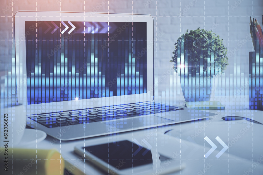 Forex market chart hologram and personal computer background. Multi exposure. Concept of investment. Forex market chart hologram and personal computer background. Multi exposure. Concept of investment.