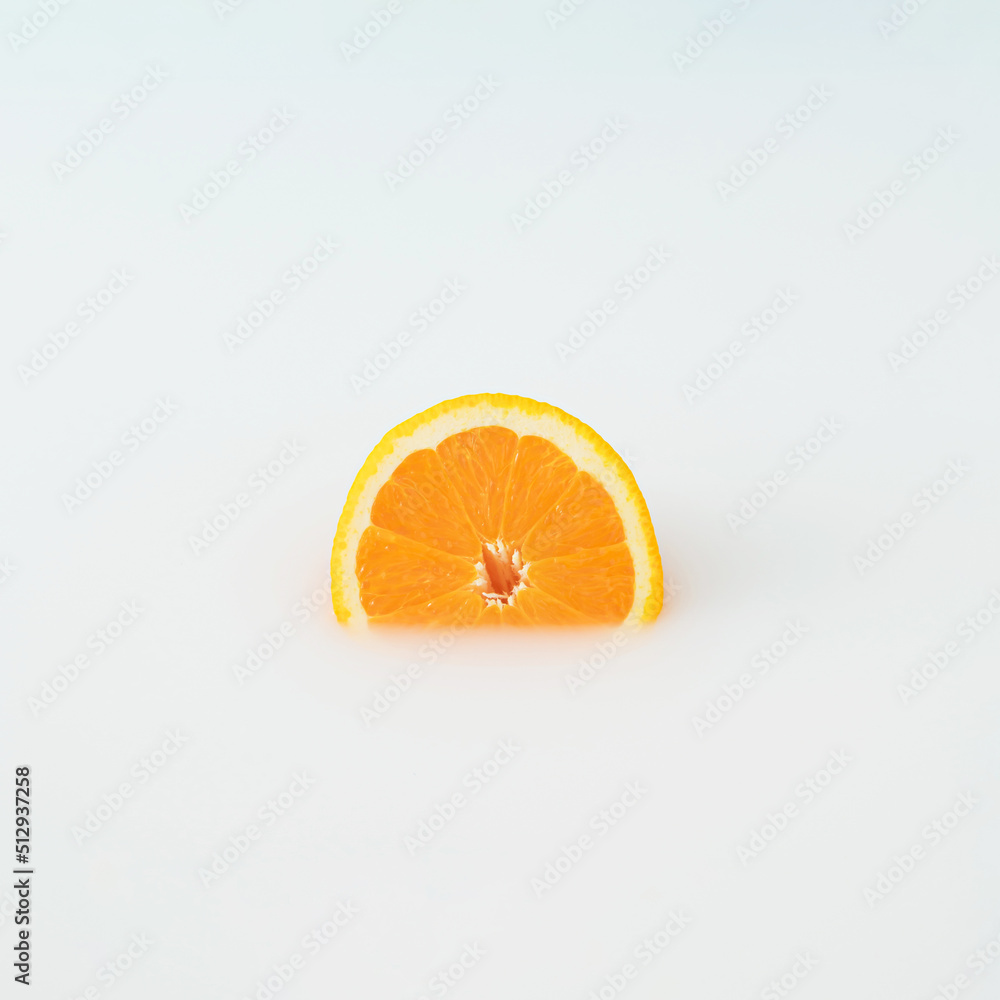 A creative minimal concept made of orange immersed in white. Sliced orange. Summer fruit inspiration. A creative minimal concept made of orange immersed in white. Sliced orange. Summer fruit inspiration.