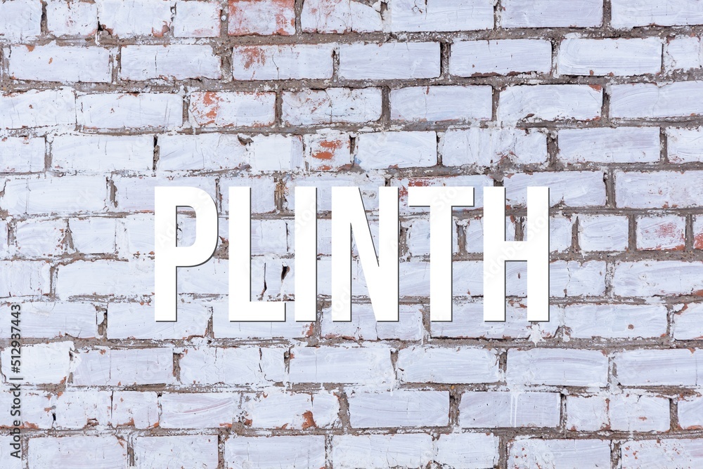 PLINTH - word on concrete background. Cement floor, wall. PLINTH - word on concrete background. Cement floor, wall.