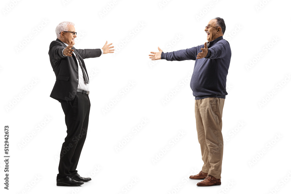 Mature men greeting each other with arms wide open Mature men greeting each other with arms wide open