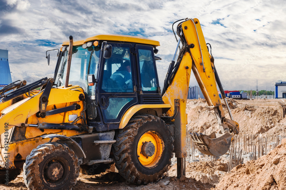 Excavator digs piles. Earthworks for the construction of the foundation. Construction equipment for the device of piles. Preparatory work for grillage.