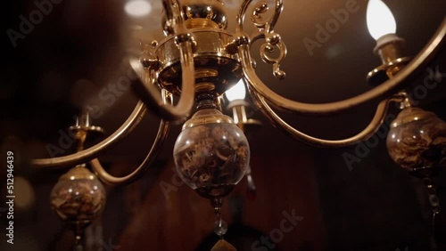 antique chandelier in gold color. lighting device