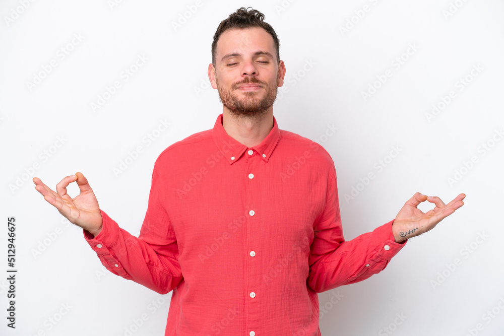 Young Brazilian man isolated on white background in zen pose Young Brazilian man isolated on white background in zen pose