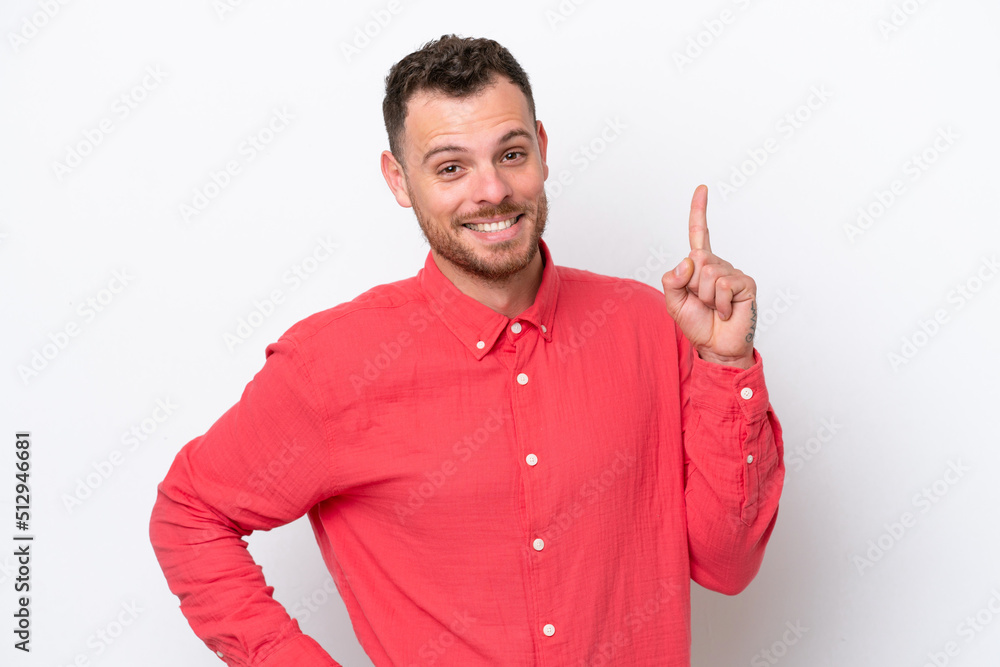 Young Brazilian man isolated on white background showing and lifting a finger in sign of the best Young Brazilian man isolated on white background showing and lifting a finger in sign of the best