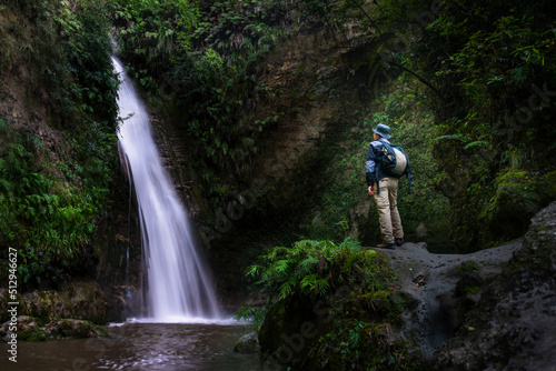 Tourist admiring Te Ana waterfalls, Hawke’s Bay. photo