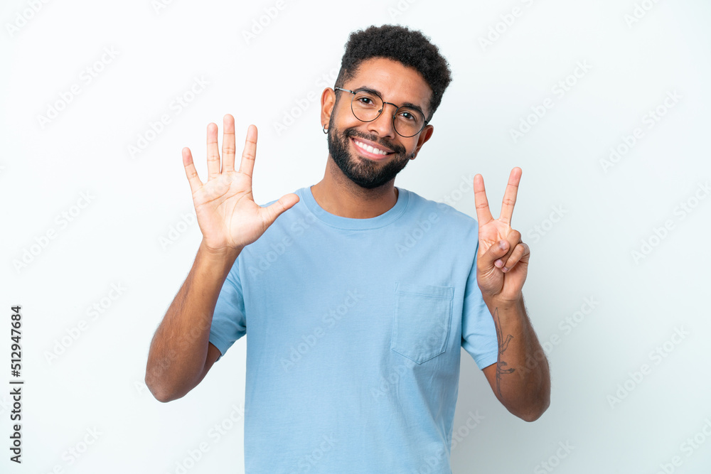 Young Brazilian man isolated on white background counting seven with fingers Young Brazilian man isolated on white background counting seven with fingers
