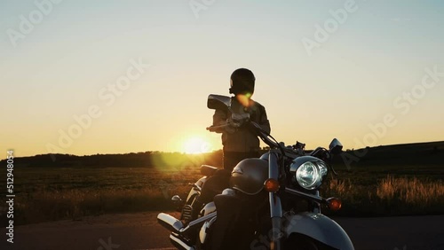 Portrait of confident motorcyclist man in motorcycle helmet