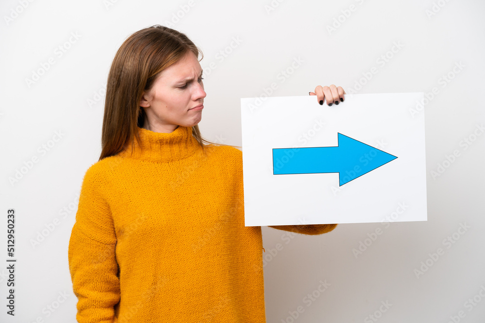 Young English woman isolated on white background holding a placard with arrow symbol Young English woman isolated on white background holding a placard with arrow symbol