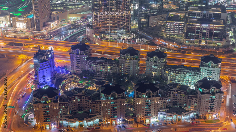 Bussy traffic on the overpass intersection in Dubai downtown aerial night timelapse. Bussy traffic on the overpass intersection in Dubai downtown aerial night timelapse.
