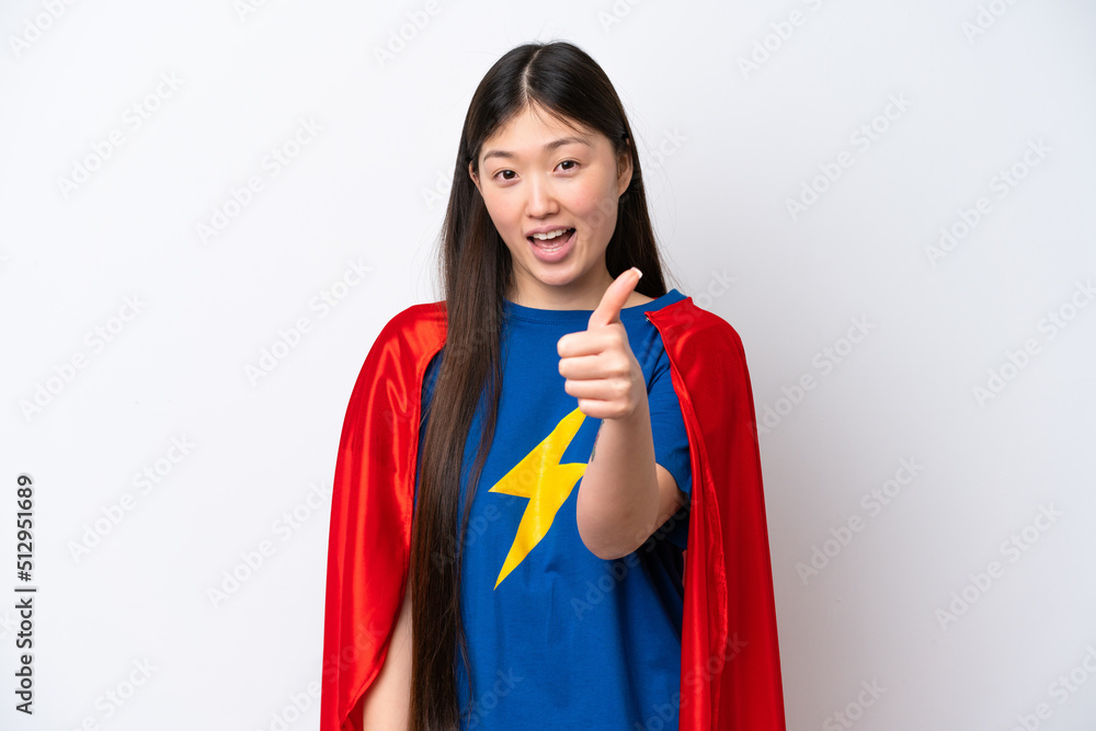 Super Hero Chinese woman isolated on white background with thumbs up because something good has happened Super Hero Chinese woman isolated on white background with thumbs up because something good has happened