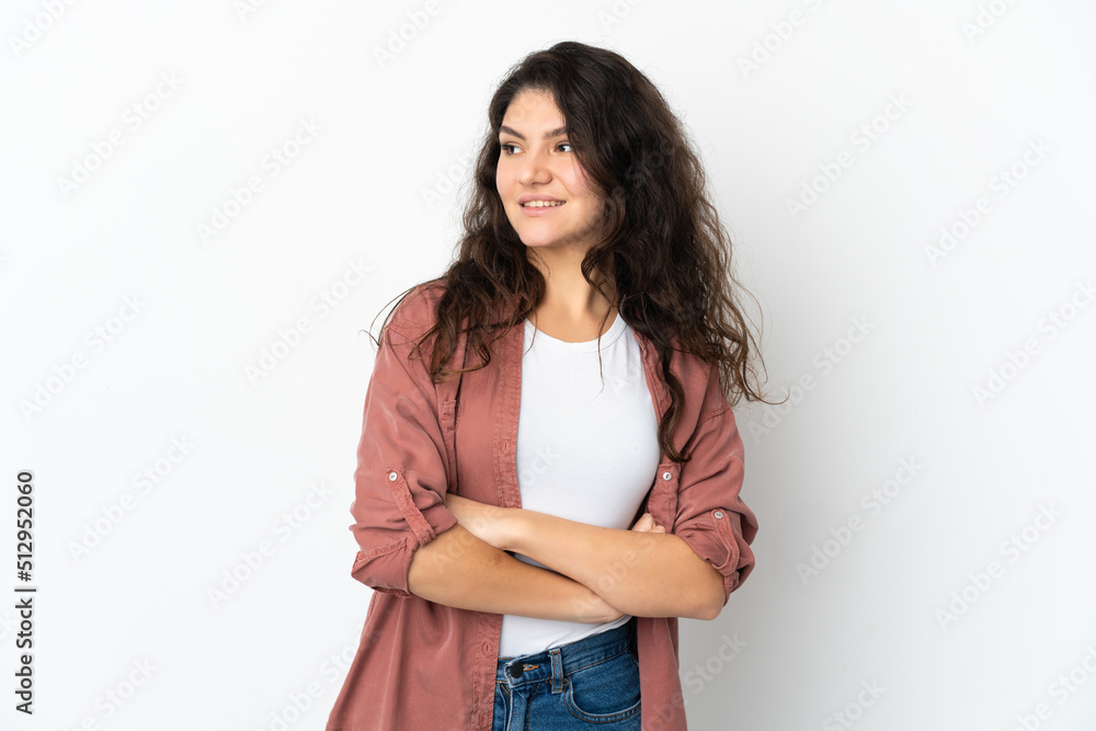 Teenager Russian girl isolated on white background looking to the side and smiling Teenager Russian girl isolated on white background looking to the side and smiling