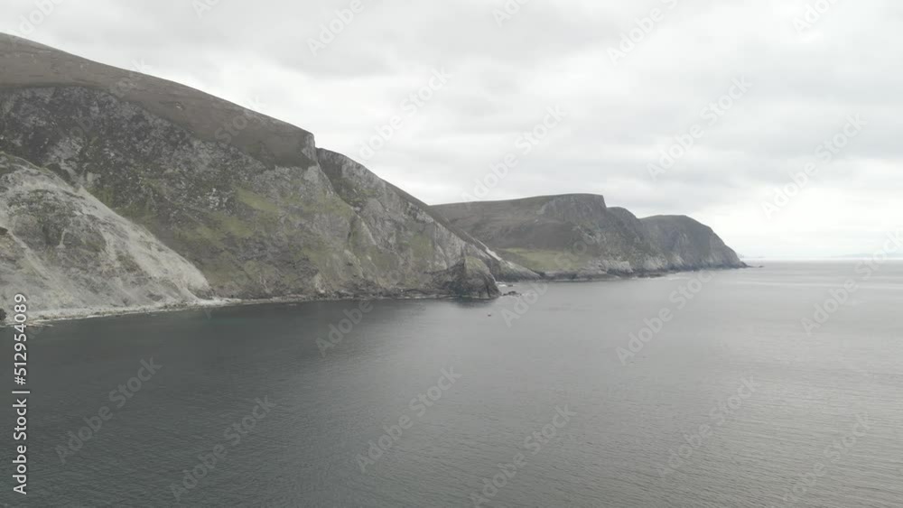 Serene View Of Minaun Cliffs And Cathedral Rocks At Keel Beach On Achill Island, County Mayo, Ireland. Aerial Wide Shot Serene View Of Minaun Cliffs And Cathedral Rocks At Keel Beach On Achill Island, County Mayo, Ireland. Aerial Wide Shot