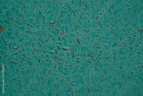 Abstract background peeling green paint on wall.