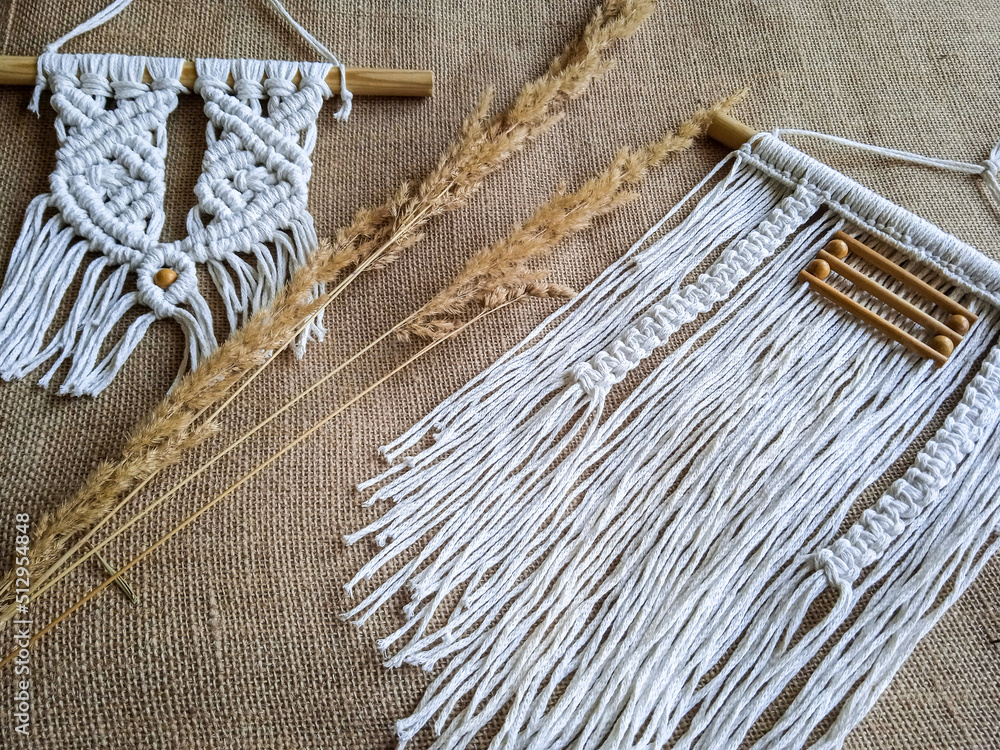 Macrame wall hanger with grain. Home decor photo for interior design. Macrame wall hanger with grain. Home decor photo for interior design.