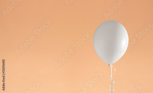mock up for design White helium balloon on warm beige background with space for text