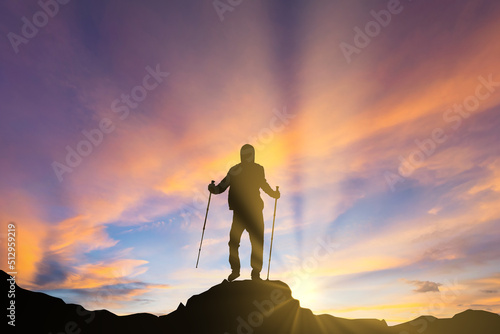 silhouette of a man on the top of mountain