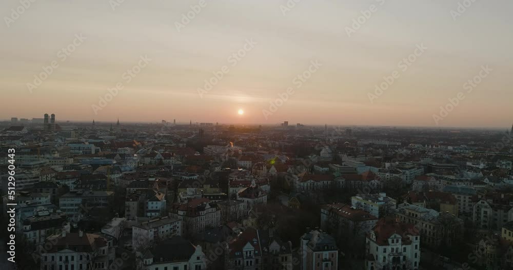 Bright Sun On Horizon In Sunset Aerial Drone Over Munich City Rooftops In Germany, 5K Bright Sun On Horizon In Sunset Aerial Drone Over Munich City Rooftops In Germany, 5K