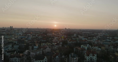 Wallpaper Mural Bright Sun On Horizon In Sunset Aerial Drone Over Munich City Rooftops In Germany, 5K Torontodigital.ca