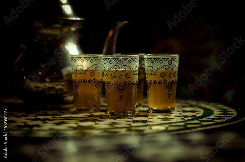 Arab tea with cups and pot on Arab style table. Granada, Spain