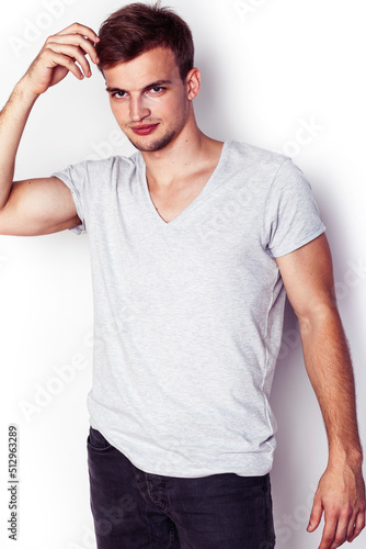 young handsome teenage hipster guy posing emotional, happy smiling against white background isolated, lifestyle people concept