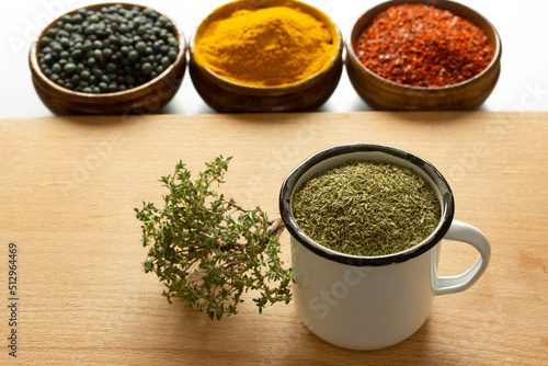Types of spices. Roasted terebinth fruits. Thyme. Turmeric. Red powdered pepper.