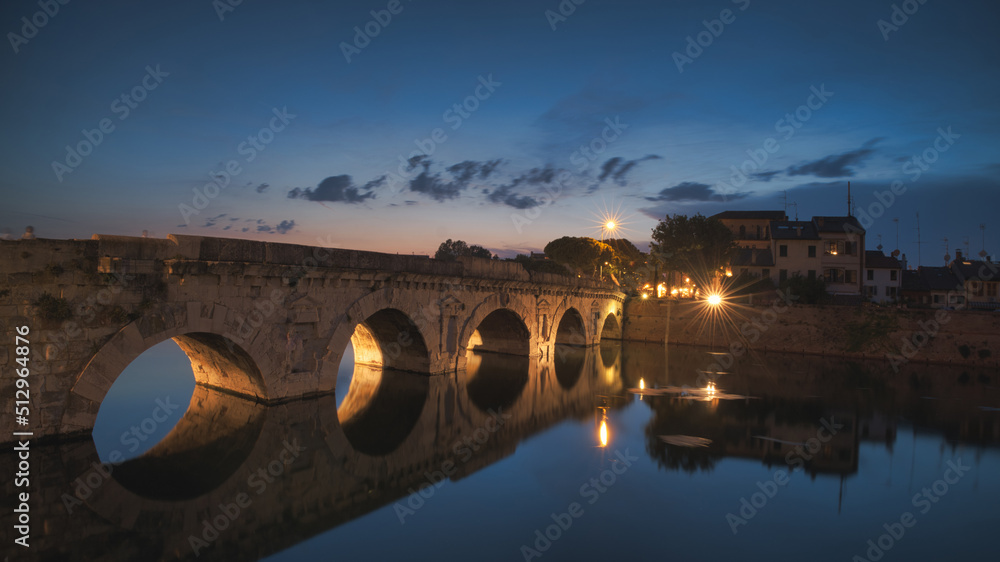 Augustus and Tiberius Bridge in Rimini at night